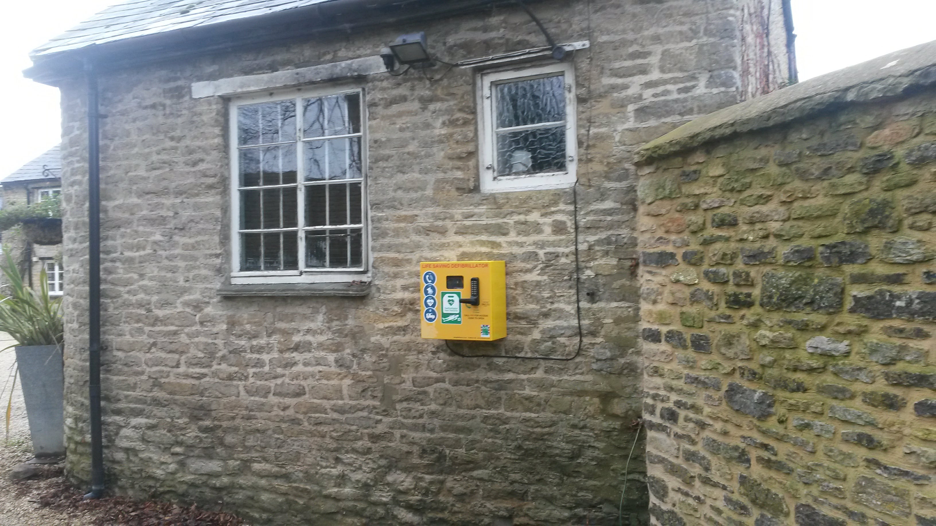 defib on pub wall